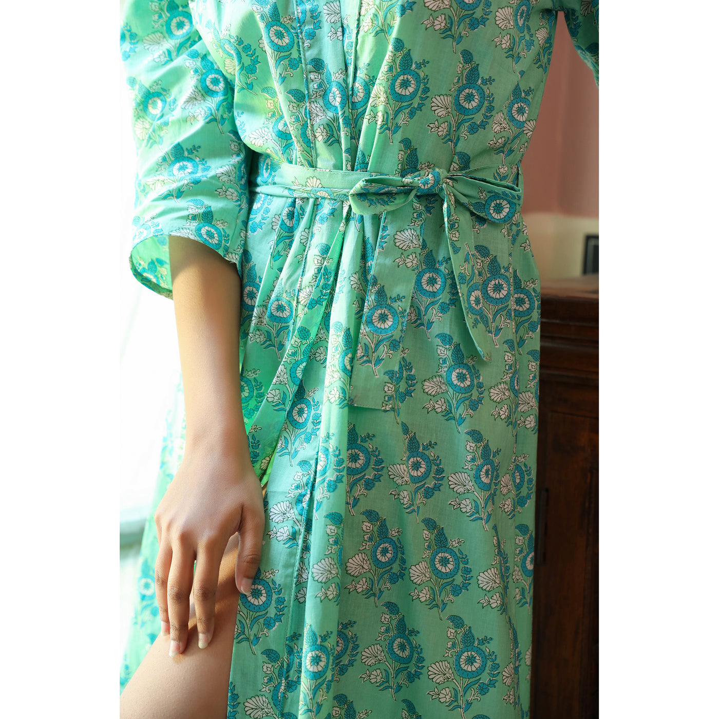 Floral Motifs on Turquoise Robe